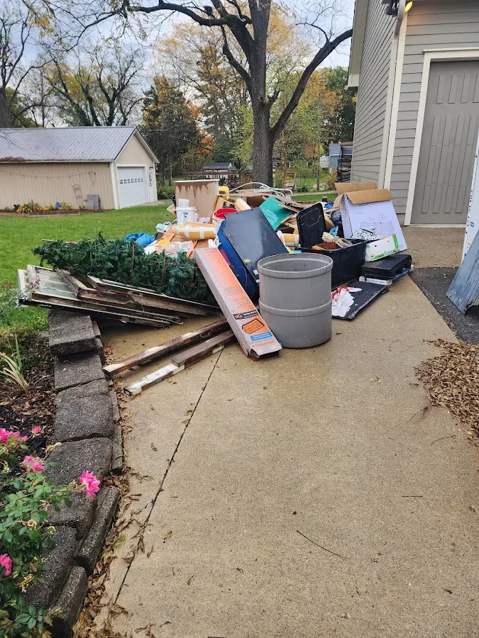 Dumpster being loaded with debris for 30 Yard Dumpster Rental in Simpsonville